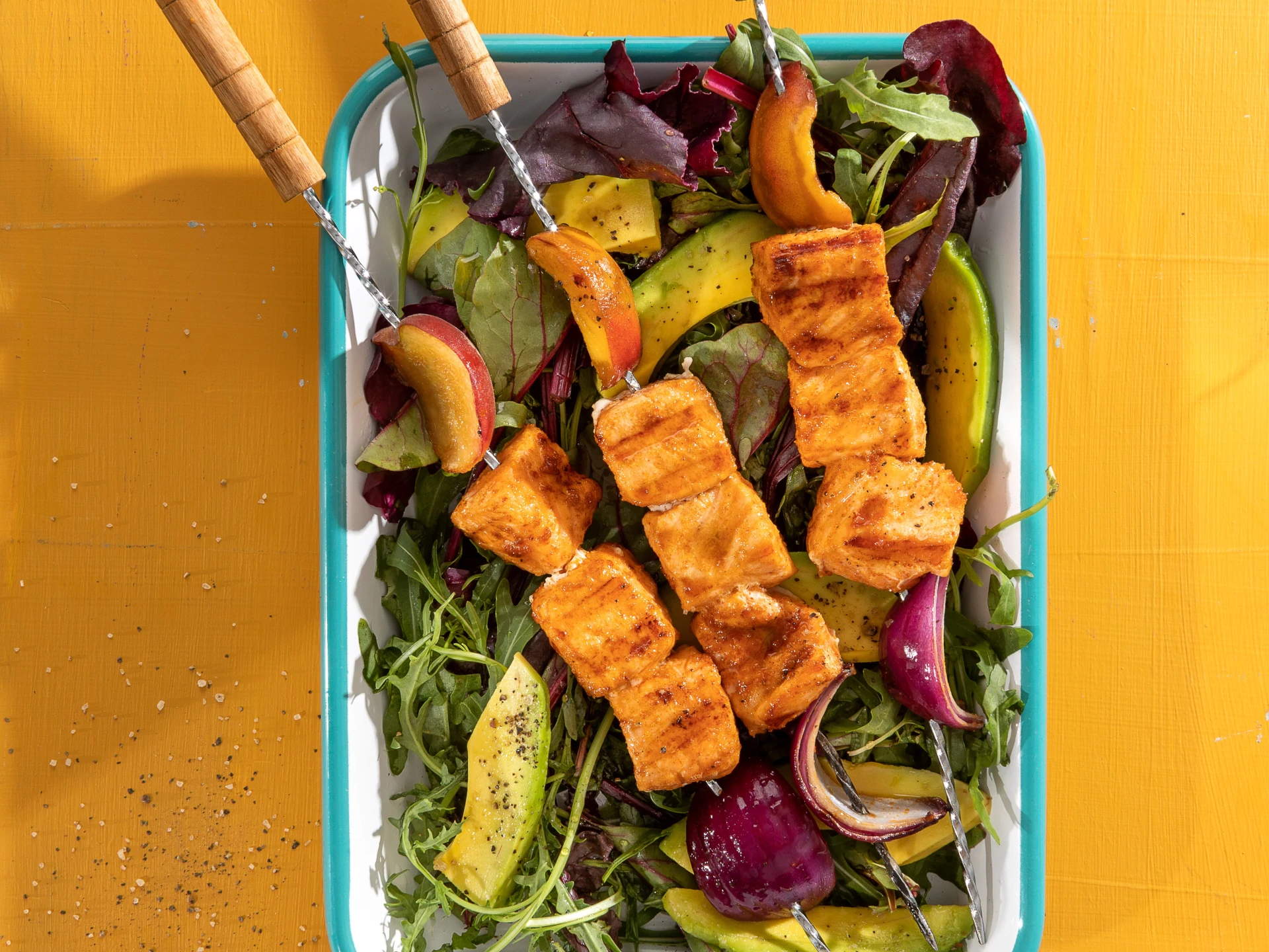 Honey-Glazed Peach and Salmon Skewers Over Greens