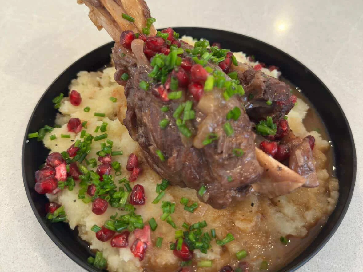 Braised Lamb Shanks in a Pomegranate Wine Sauce with a Garlic Confit Mashed Potatoes