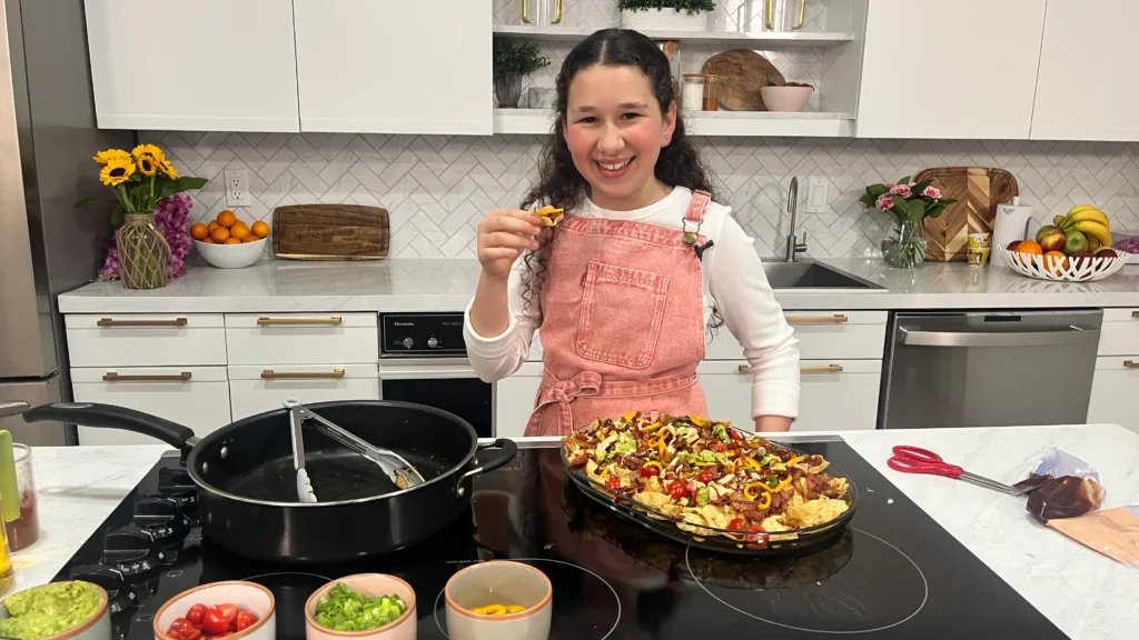 Tova Wolbe Esty Wolbe's daughter making ultimate Purim party food loaded pastrami nachos