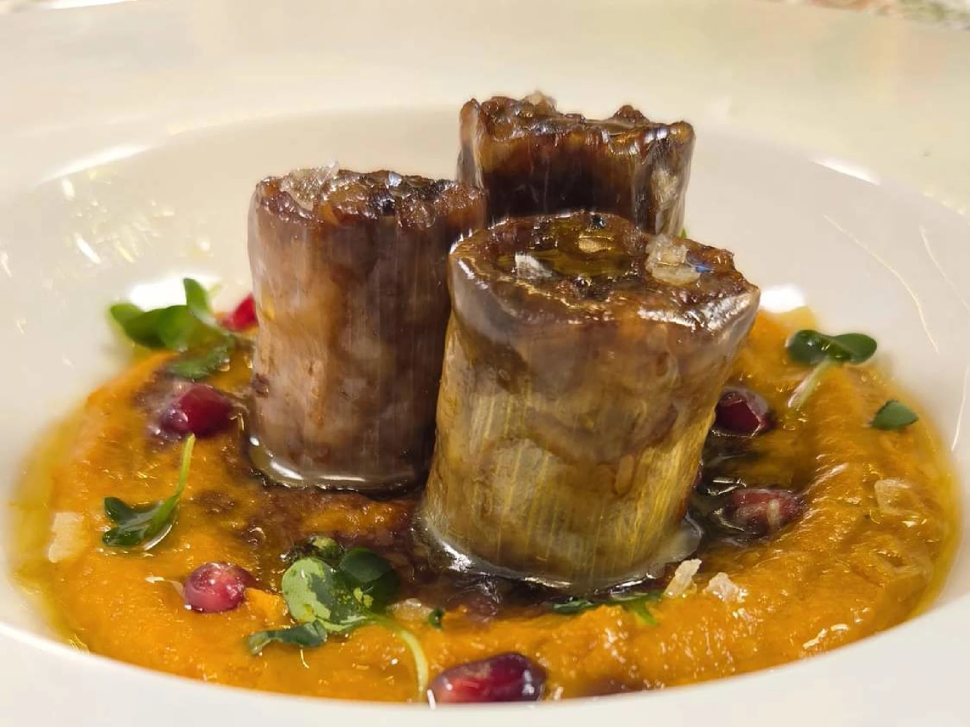 Honey-Pomegranate Glazed Stuffed Leeks over Roasted Carrot, Butternut, and Golden Beet Puree