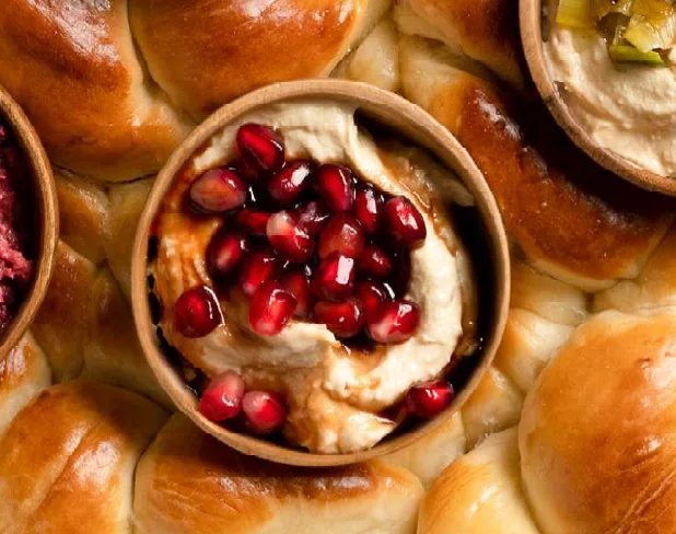 Date and Rimon over Hummus