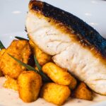 Sea Bass with Potato Gnocchi and Truffle Parmesan Velouté