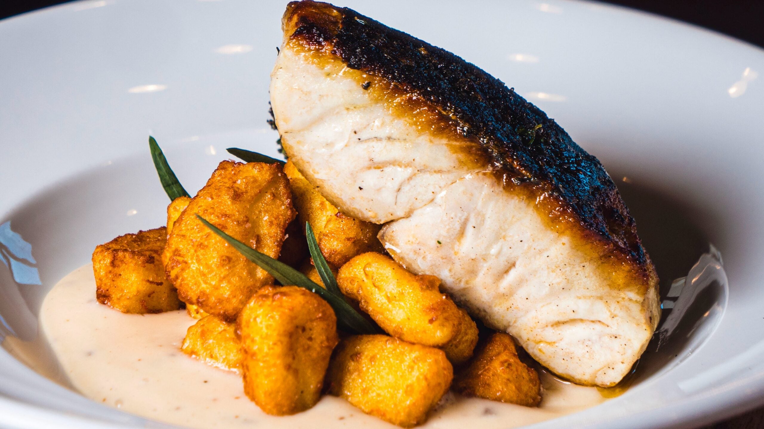 Sea Bass with Potato Gnocchi and Truffle Parmesan Velouté