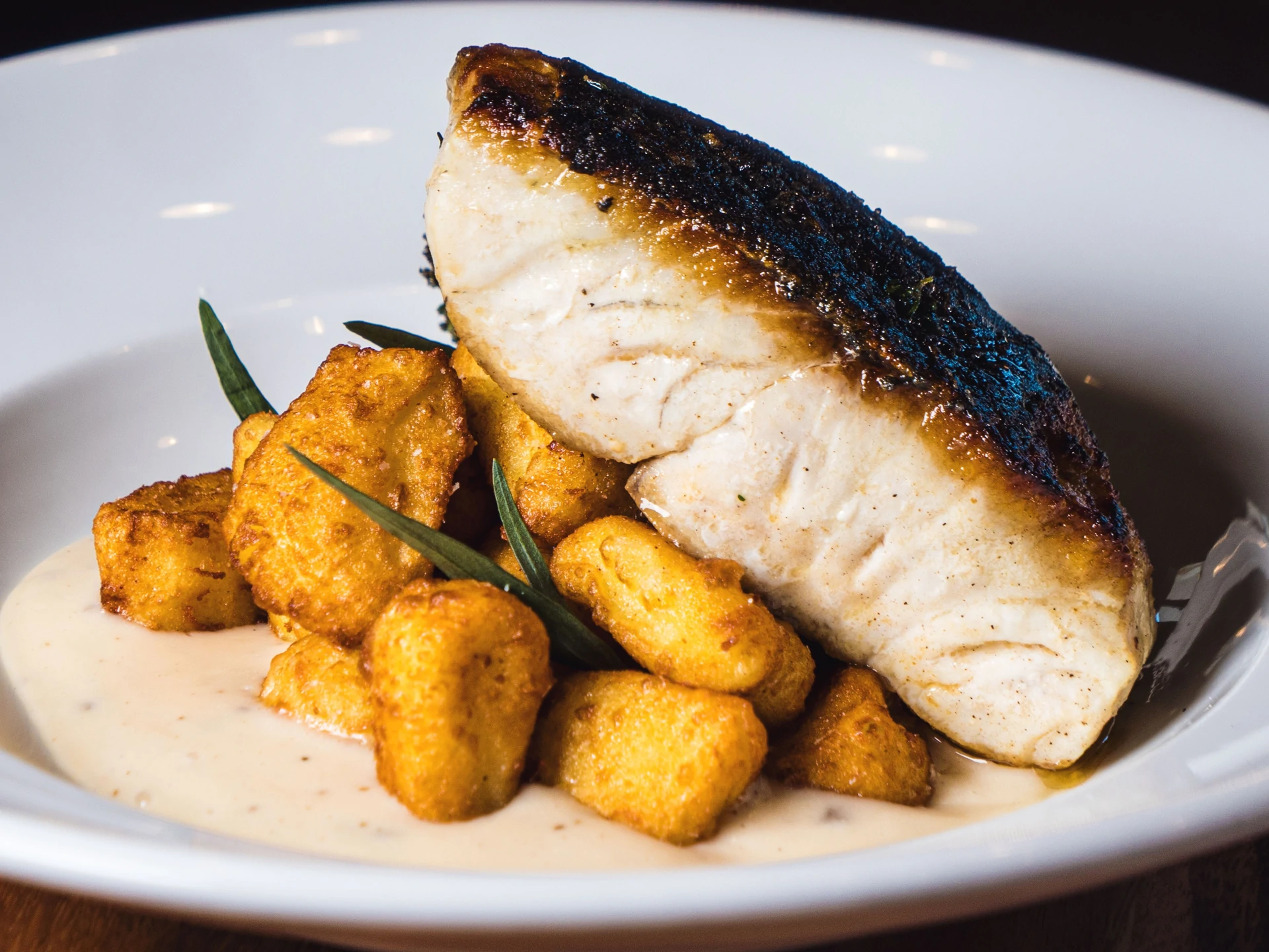 Sea Bass with Potato Gnocchi and Truffle Parmesan Velouté