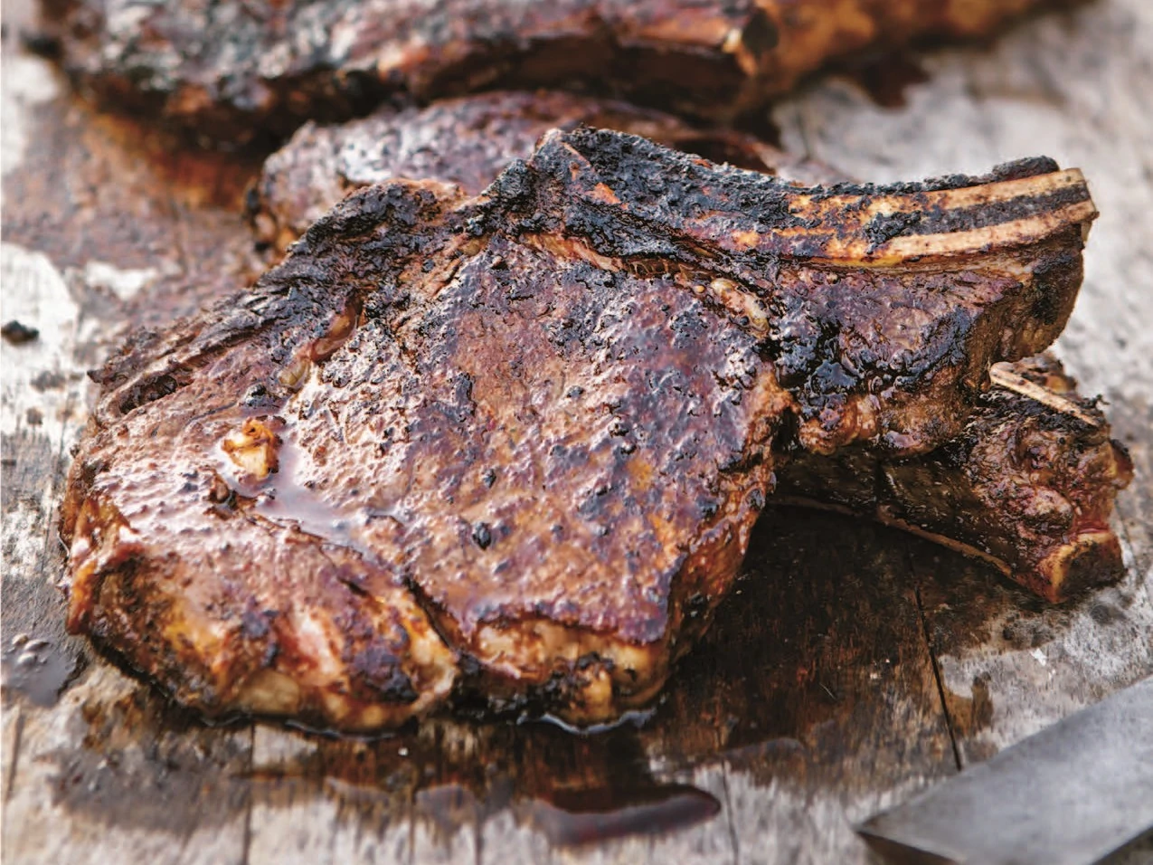 Cowboy Rib Eyes with Chipotle Spice Paste and Charred Corn and Tomato Salad